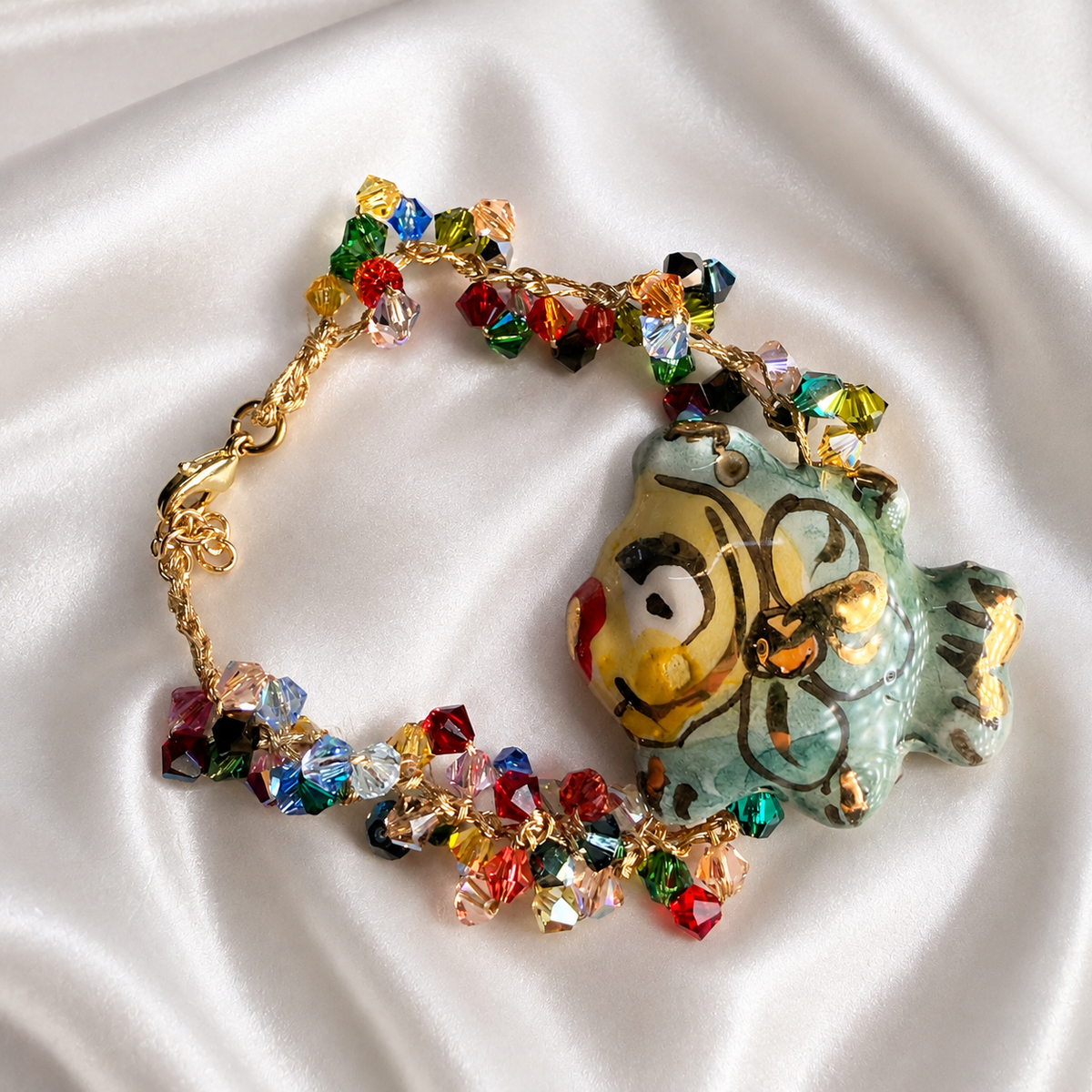 Handmade Sicilian ceramic fish bracelet with colorful Swarovski crystals and gold details