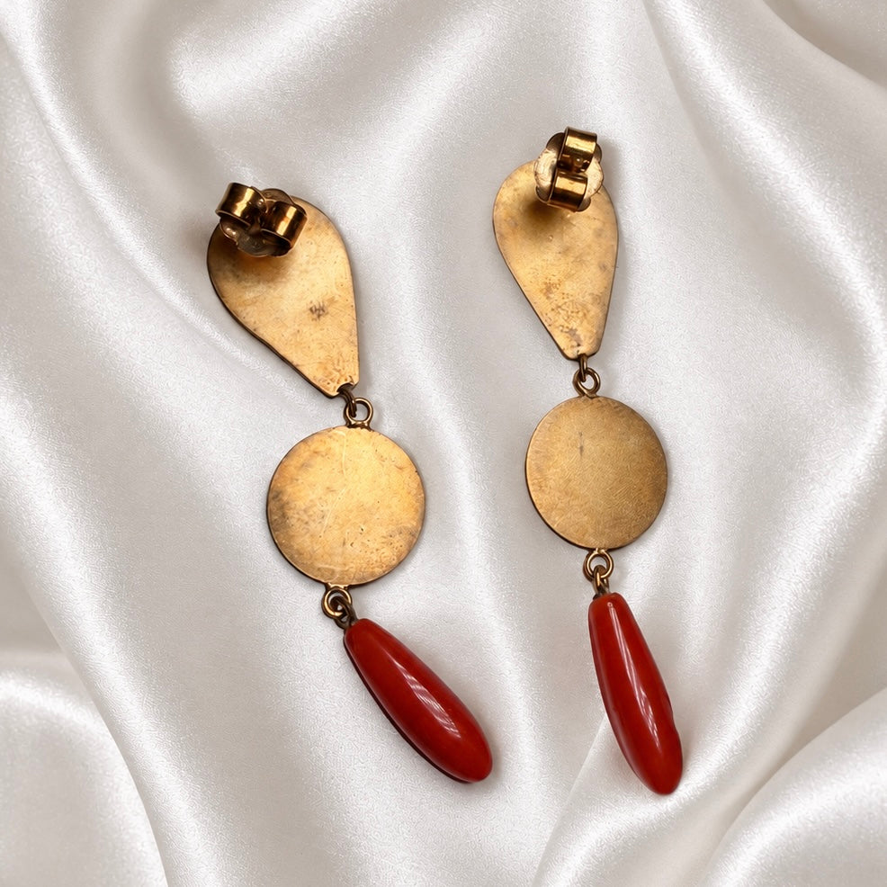 Back view of Sardinian red coral and 925 silver drop earrings, showing gold-tone settings and butterfly backs on white satin.