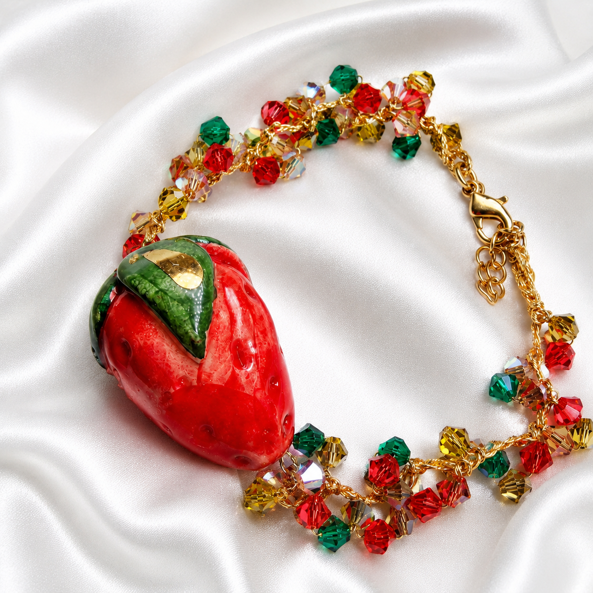 Strawberry Glow Sicilian bracelet with ceramic strawberry, Swarovski crystals and handcrafted gold crochet work