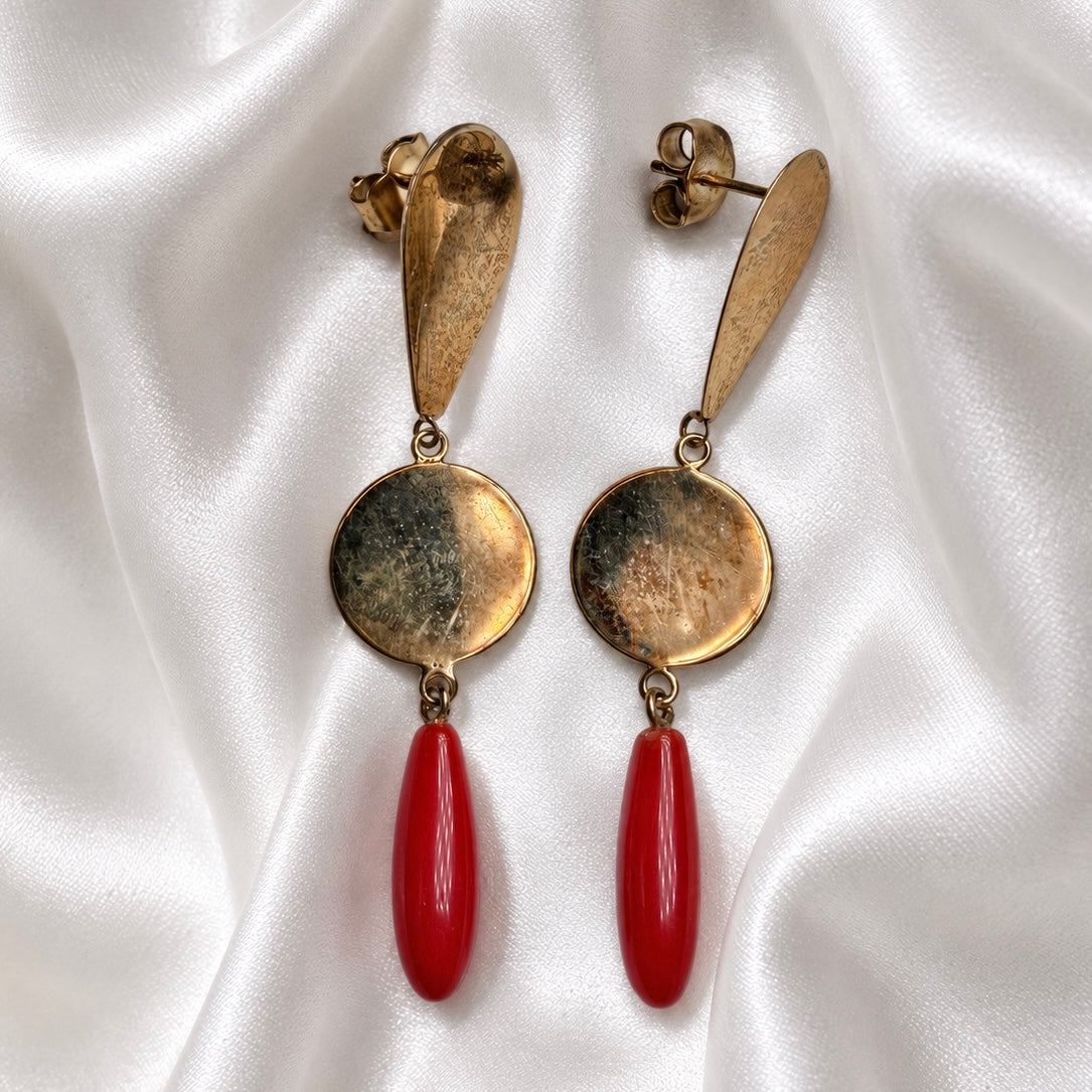 Sardinian red coral and 925 silver earrings on white satin, showing gold-tone discs, teardrop tops, and butterfly backs.
