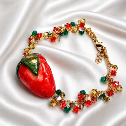 Handmade Sicilian strawberry bracelet with hand-painted Caltagirone ceramic strawberry and Swarovski crystals on white satin