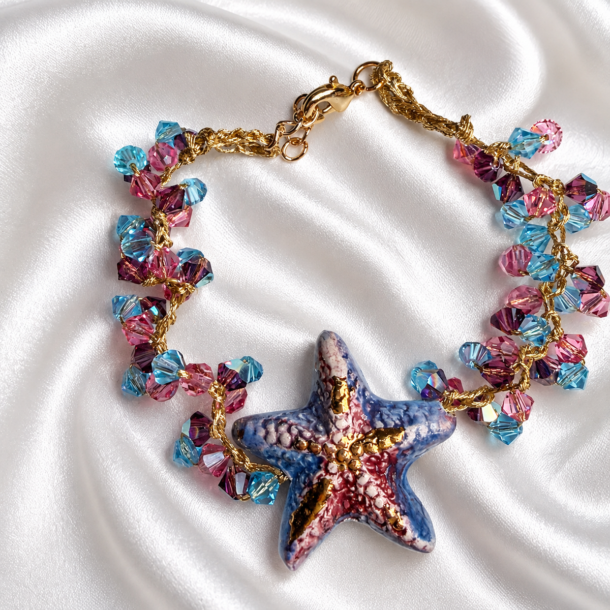 Sicilian ceramic starfish bracelet with hand-painted pendant, pink and blue Swarovski crystals and gold-plated details