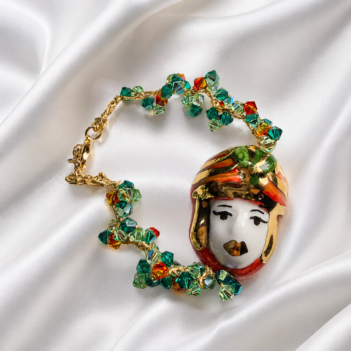 Moor’s Muse handmade Sicilian Testa di Moro bracelet with hand-painted Caltagirone ceramic and green orange Swarovski crystals