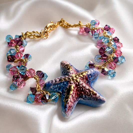 Handmade Sicilian ceramic starfish bracelet with pink and blue Swarovski crystals and gold-plated details