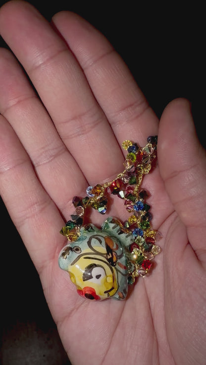 Video showing handmade Sicilian ceramic fish bracelet with multicolor Swarovski crystals held in hand