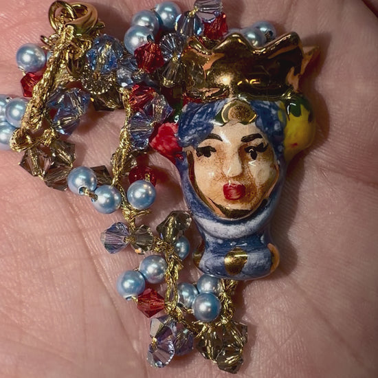 Video showing Moor’s Crown handmade Sicilian Testa di Moro bracelet with Swarovski crystals and blue Majorca pearls