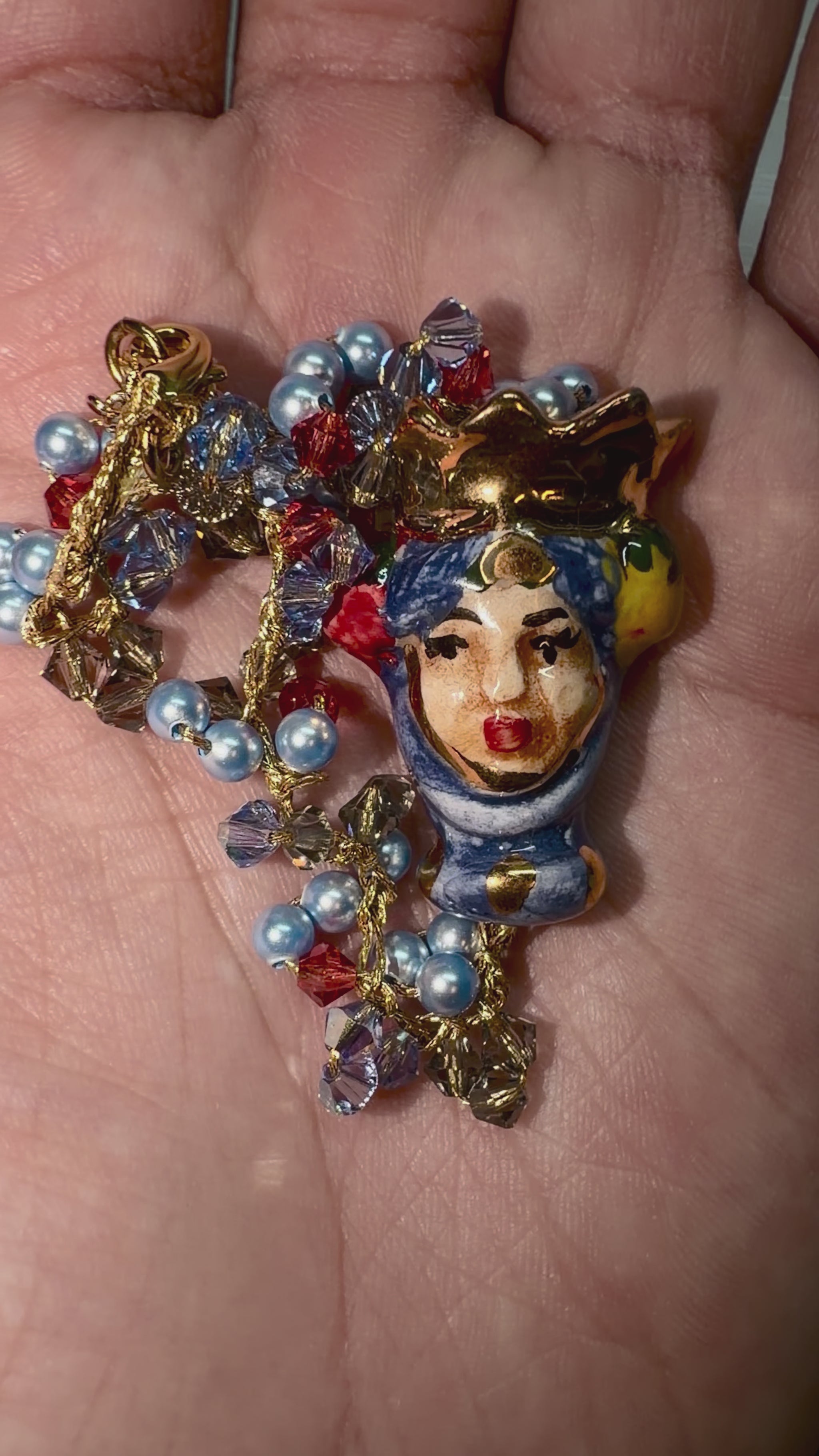 Video showing Moor’s Crown handmade Sicilian Testa di Moro bracelet with Swarovski crystals and blue Majorca pearls